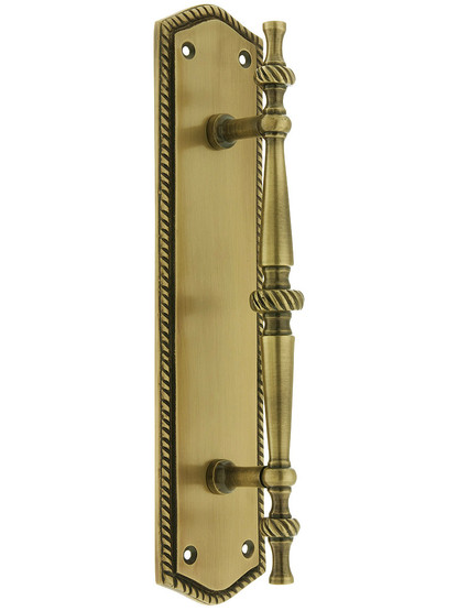 Small Traditional Door Pull With Rope Back Plate in Antique Brass.